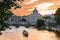 Panoramic View of the Dome of the Basilic of Saint Peter in Rome beside the Bridge on the Tevere River in Rome at Sunset