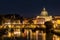 Panoramic View of the Dome of the Basilic of Saint Peter in Rome beside the Bridge on the Tevere River in Rome at Sunset