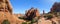 Panoramic view of dramatic rock formations and towers in Arches National Park