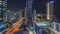 Panoramic view of the Dubai Marina and JBR area and the famous Ferris Wheel aerial night timelapse