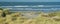 Panoramic view with dunes, beach and North Sea waves