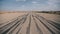 Panoramic view of a dusty road near the Negev desert, Israel with traces of tires