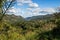 Panoramic view from El Nicho waterfall mountain, palm trees, lake