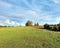 Panoramic view of empty masurian grass field at the sunset with copy space