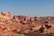 Panoramic view of endless winding empty road leading to red Aztec Sandstone Rock formations in Mojave desert, Nevada, USA