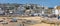 Panoramic view of the esplanade around the harbour at low tide in St Ives, Cornwall, UK