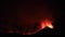 Panoramic view of Etna eruption in Sicily in the night with intense molten lava explosion