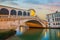 Panoramic view of famous Canal Grande with famous Rialto Bridge at sunset, Venice