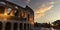 Panoramic view with  the famous of the Coliseum or Flavian Amphitheatre Amphitheatrum Flavium or Colosseo,  sunset sky scene  at