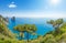 Panoramic view of famous Faraglioni rocks from Capri island, Italy