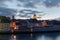 Panoramic view of the famous skyline of Regensburg in Bavaria seen from the Stone Bridge with dramatic clouds in evening sky