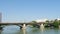 Panoramic view of famous Triana river bridge with perople and traffic in Seville city, European Spanish landmark