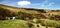 Panoramic view of a farmhouse in the hills of the Peak District in the UK