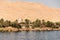 Panoramic view of fertile banks of Nile and everyday life during river cruise River near Luxor Egypt direction assuan