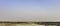 Panoramic view of fields with Taj Mahal in background - Agra, India
