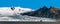 Panoramic view of  Fjallsjokull glacier calving into lagoon in background