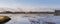 Panoramic view of a flock of birds in the natural park of Albufera at sunrise, Valencia, Spain