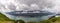 Panoramic view of Gastineau Channel, port of Juneau and mountains covered with clouds from the top of mountain Roberts in Alaska