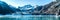 Panoramic view in Glacier Bay from cruise ship cruising towards Johns Hopkins Glacier in summer in Alaska, USA. Banner