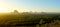 Panoramic view of Glass House Mountains at sunset in Queensland, Australia.