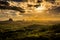 Panoramic view of Glass House Mountains at sunset visible from W