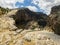 Panoramic view of the gorge with prehistoric caves over the the wide and almost dry river bed. Cendere stream. Turkey