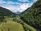 Panoramic view on green Alpine spruce and pine tree forests and meadows near Saint-Gervais-les-Bains, Savoy. France
