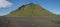 Panoramic view on green Hattafell mountain in Volcanic landscape with resting tourist. Laugavegur trek in area of