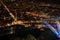 Panoramic view of Grenoble city illuminated at night and the cable car cabin`s shadows