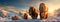 panoramic view of a group of woolly mammoths walking across a snowy tundra at sunset