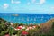 Panoramic view of Gustavia harbour seen from Corossol, hill, red roofs, St Barth, sailboats