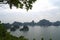 A Panoramic View Of HaLong Bay, Vietnam With Its Limestone Islands And Tour Boats,