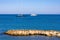 Panoramic view of harbor and yachts with French riviera shore in background seen from Azure Cost of Antibes city in France