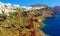 Panoramic view from a height above the houses, villas and the Mediterranean sea.Beautiful natural landscape.Santorini Thira isla