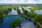 A panoramic view from a height of the ponds and the Landscape Park in Peterhof, the meadow garden, walking paths, the destroyed