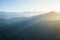 Panoramic view from Herzogstand with the mountainscape with foggy sunset.
