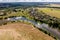 panoramic view from a high altitude of a meandering river in the forest