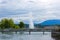 Panoramic view of historic Geneva Jet d\'Eau fountain at harbor district