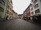 Panoramic view of historic traditional buildings in empty cobblestone streets of Feldkirch Vorarlberg Austria alps