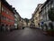 Panoramic view of historic traditional buildings in empty cobblestone streets of Feldkirch Vorarlberg Austria alps
