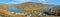 Panoramic view of historical town Oberwesel on the Rhine river with vineyards and barges under blue sky and sunshine