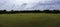 Panoramic view of home plate on baseball field from centerfield