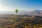 Panoramic view with hot air balloon flying over picturesque rock formation