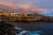 Panoramic view of the Illuminated Las Americas at night against the colorful sunset sky with lights on the horizon on