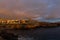 Panoramic view of the Illuminated Las Americas at night against the colorful sunset sky with lights on the horizon on