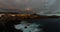 Panoramic view of the Illuminated Las Americas at night against the colorful sunset sky with lights on the horizon on