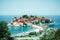 Panoramic view of island of Sveti Stefan, on old stone houses wi