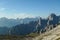 Panoramic view on Italian Dolomites. Endless, high and sharp mountains from each side. The peaks are shrouded in morning haze.