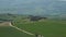 Panoramic view of Italian landscape with gladiators road, villa, hill, cypresses