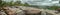 Panoramic view of the Kalandula waterfalls on Lucala river, tropical forest and cloudy sky as background